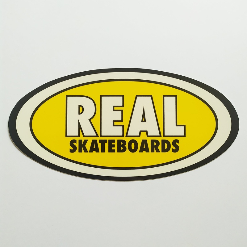 Real Skateboards Oval Sticker – yellow medium